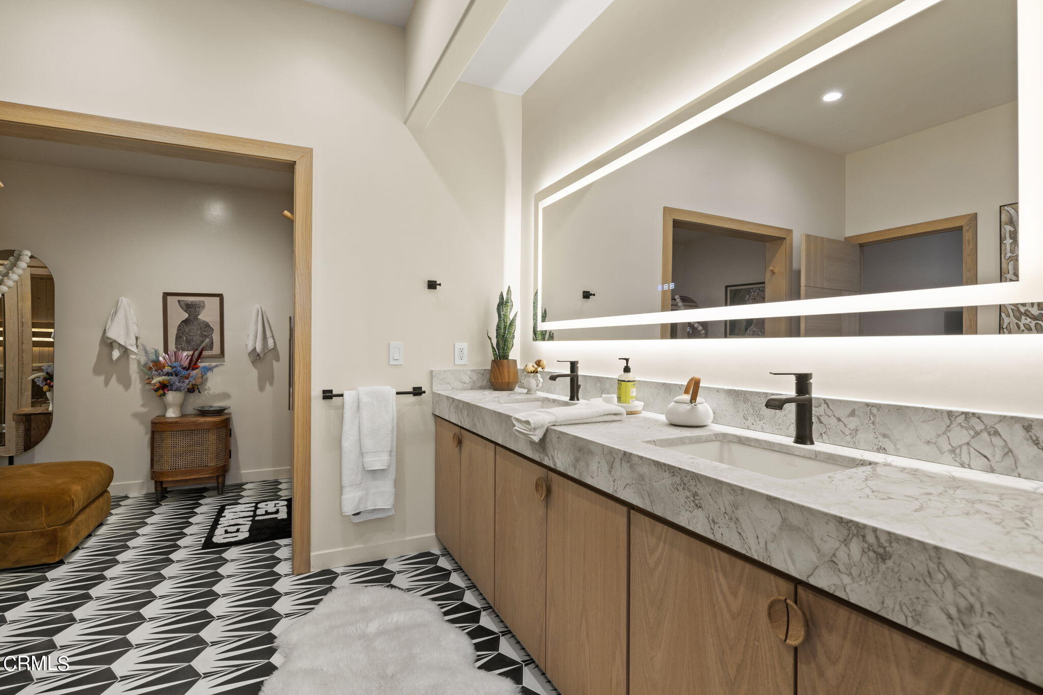 4136 Ocean Drive Oxnard, CA 93035 - Photo 22 of 58 a bathroom with a granite countertop sink and a mirror