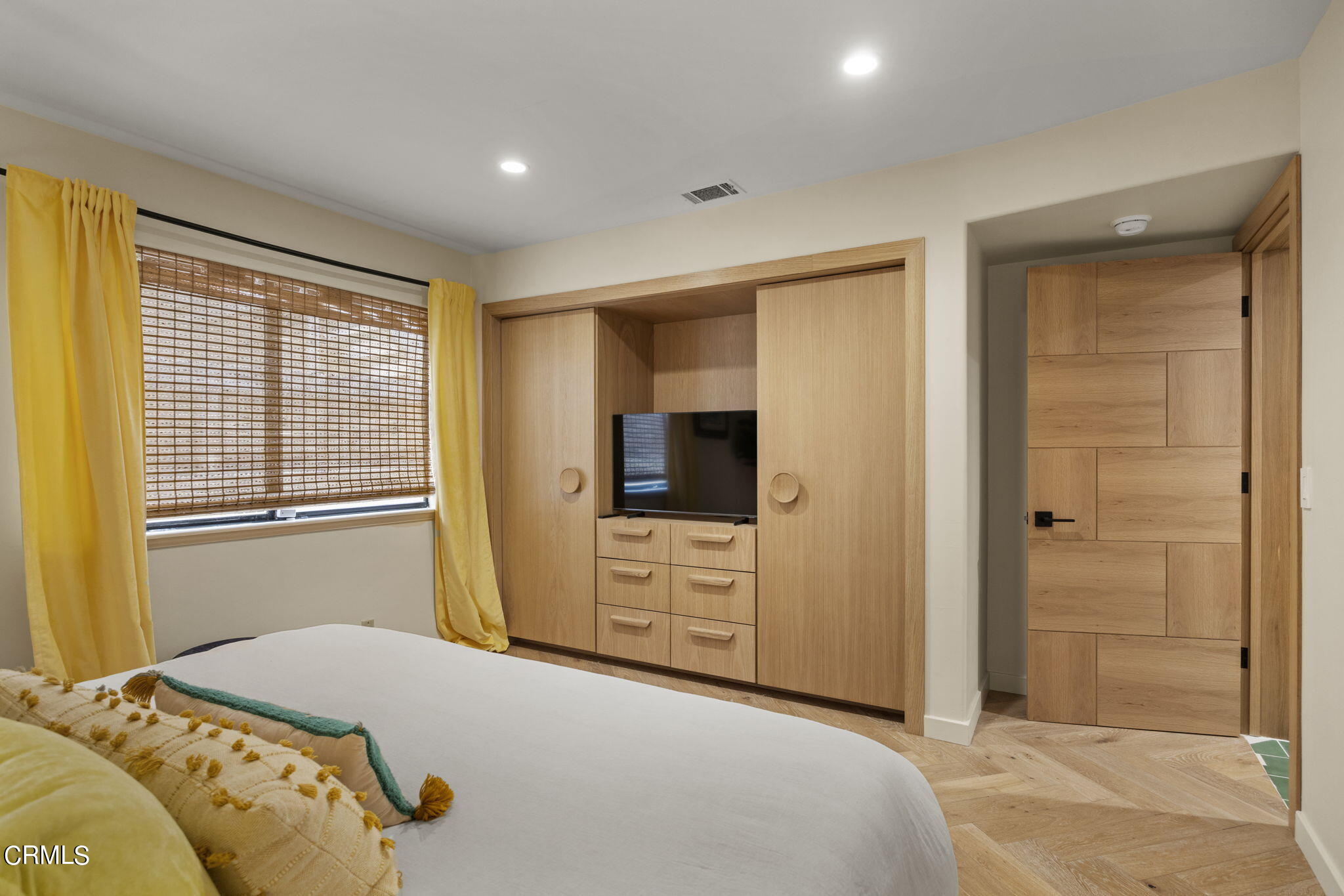 4136 Ocean Drive Oxnard, CA 93035 - Photo 26 of 58 a bedroom with a bed and a television