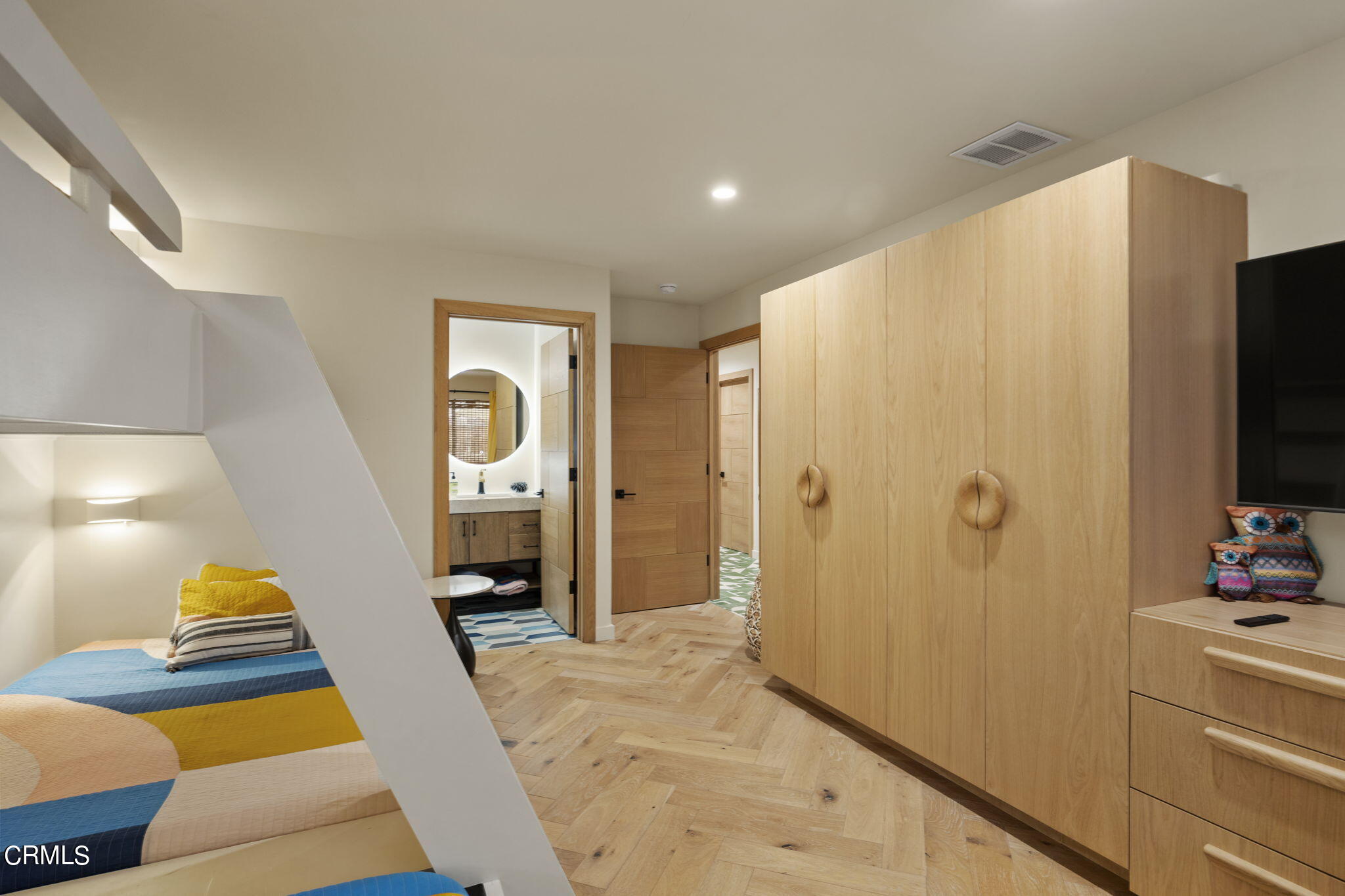 4136 Ocean Drive Oxnard, CA 93035 - Photo 30 of 58 a bedroom with a bed and a flat screen tv