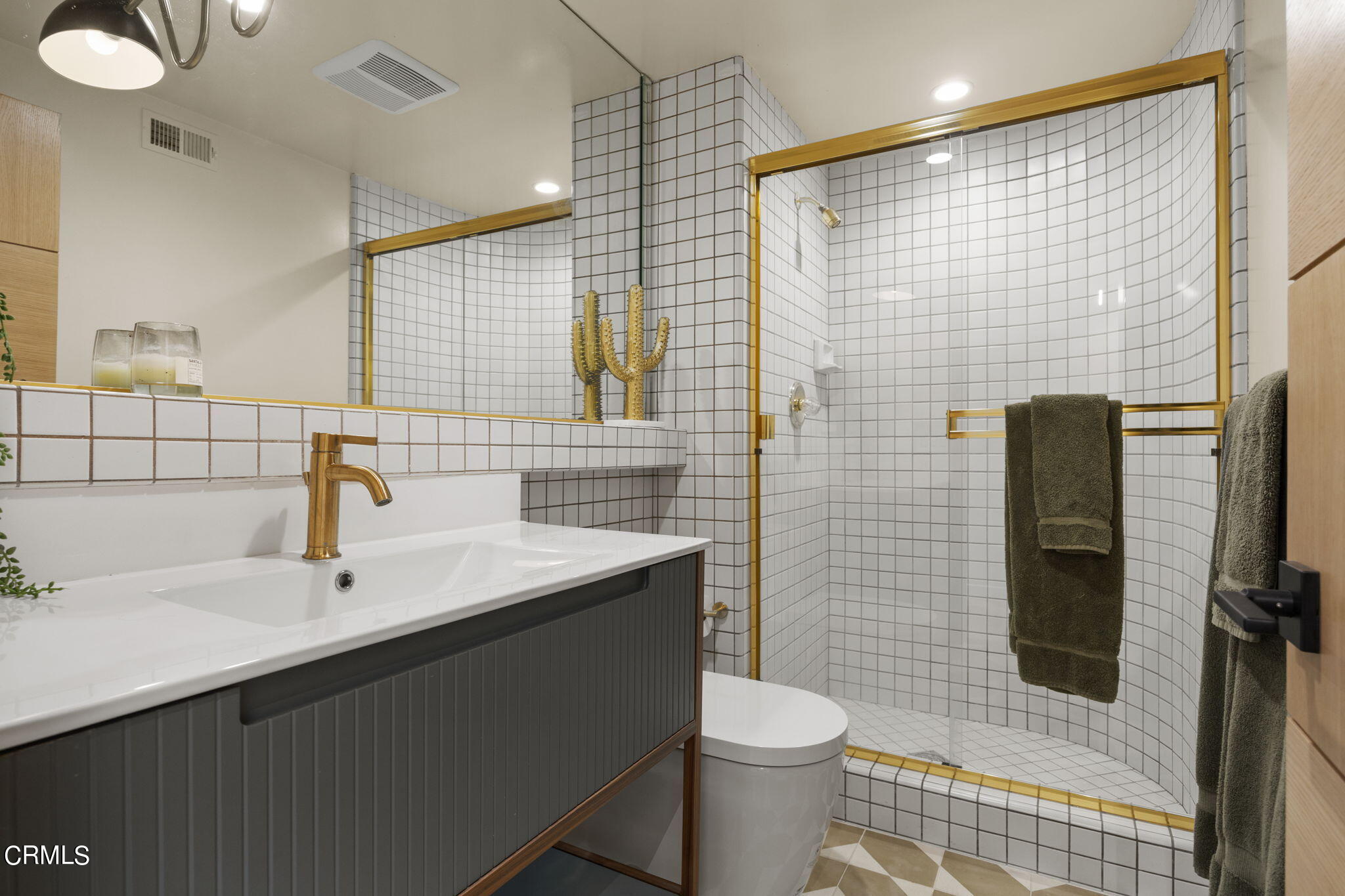 4136 Ocean Drive Oxnard, CA 93035 - Photo 33 of 58 a bathroom with a sink toilet and shower