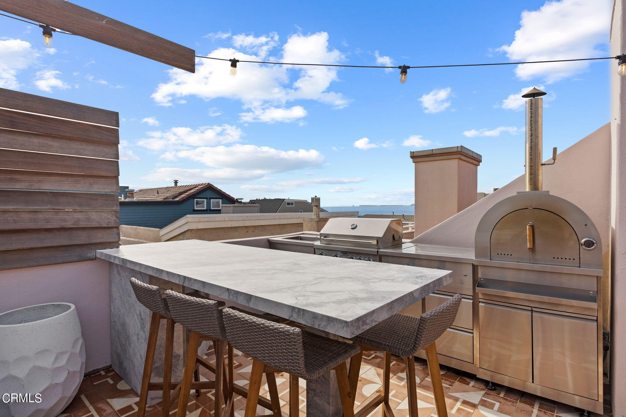 4136 Ocean Drive Oxnard, CA 93035 - Photo 46 of 58 a view of a dinning table and chairs in the patio