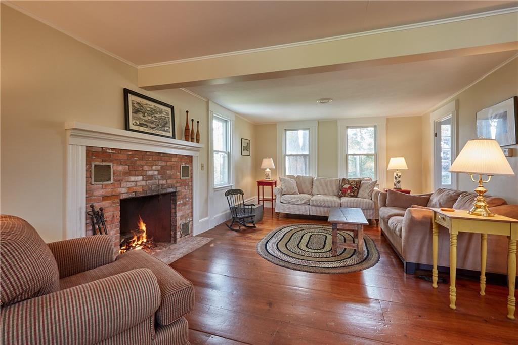 546 Harrington Road Bristol, ME 04539 - Photo 11 of 31 Living room with central hearth