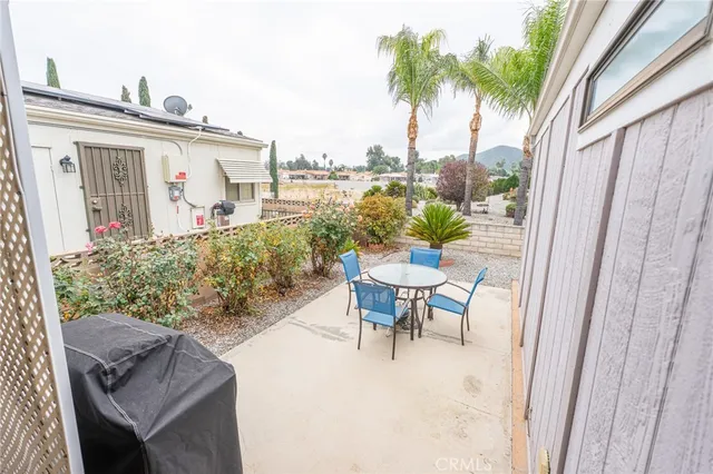 a view of a house with a wooden fence