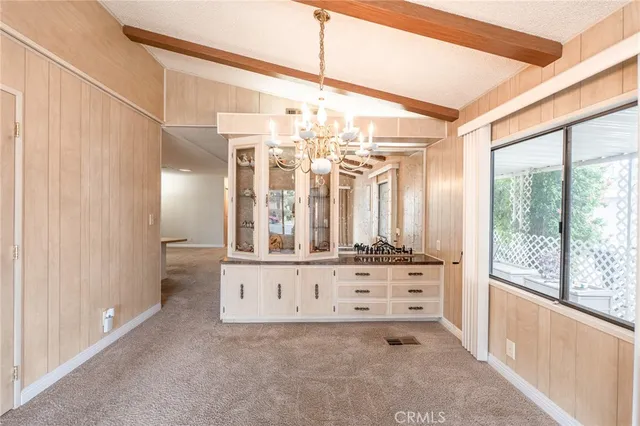 a view of a large kitchen with a window
