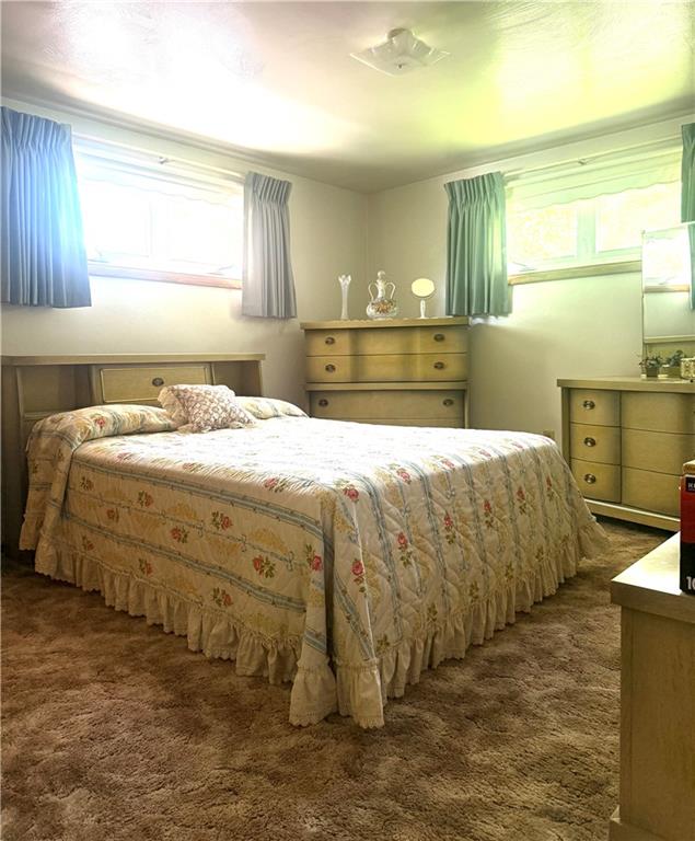 151 Huntingdon Road Wyano, PA 15695 - Photo 24 of 36 a bedroom with a bed and a dresser
