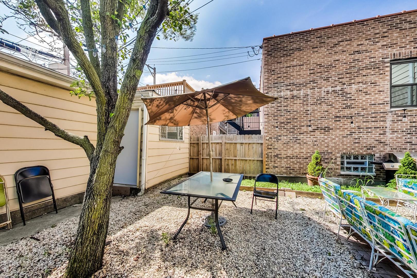2145 West Thomas Street, Unit 2 Chicago, IL 60622 - Photo 12 of 14 a view of a backyard with a sitting area