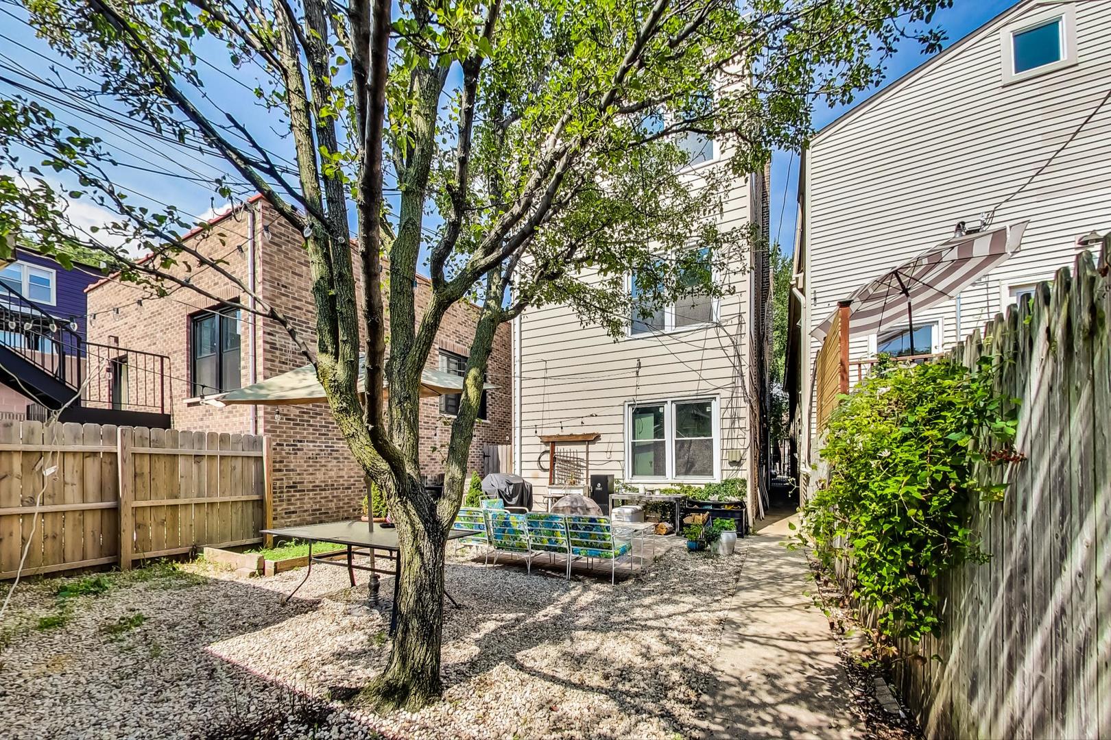 2145 West Thomas Street, Unit 2 Chicago, IL 60622 - Photo 13 of 14 a view of a house with a yard