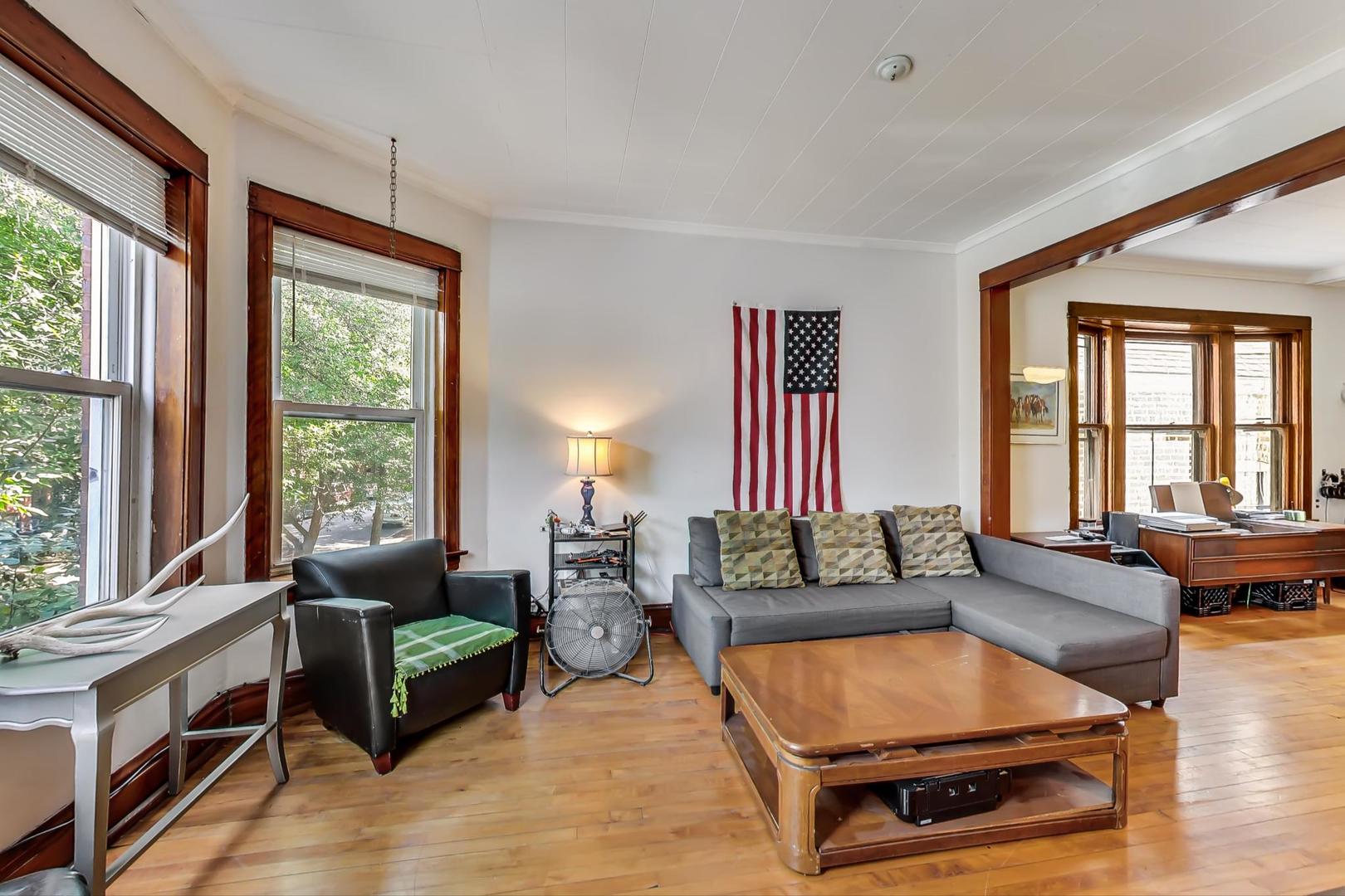 2145 West Thomas Street, Unit 2 Chicago, IL 60622 - Photo 4 of 14 a living room with furniture and a large window