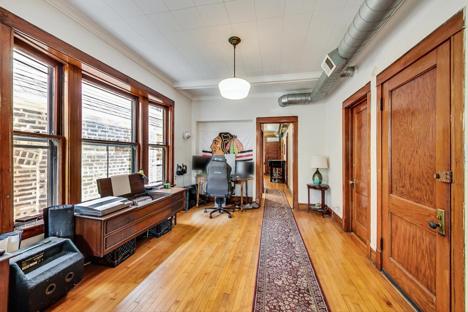 2145 West Thomas Street, Unit 2 Chicago, IL 60622 - Photo 5 of 14 a very nice looking room with a large window and furniture
