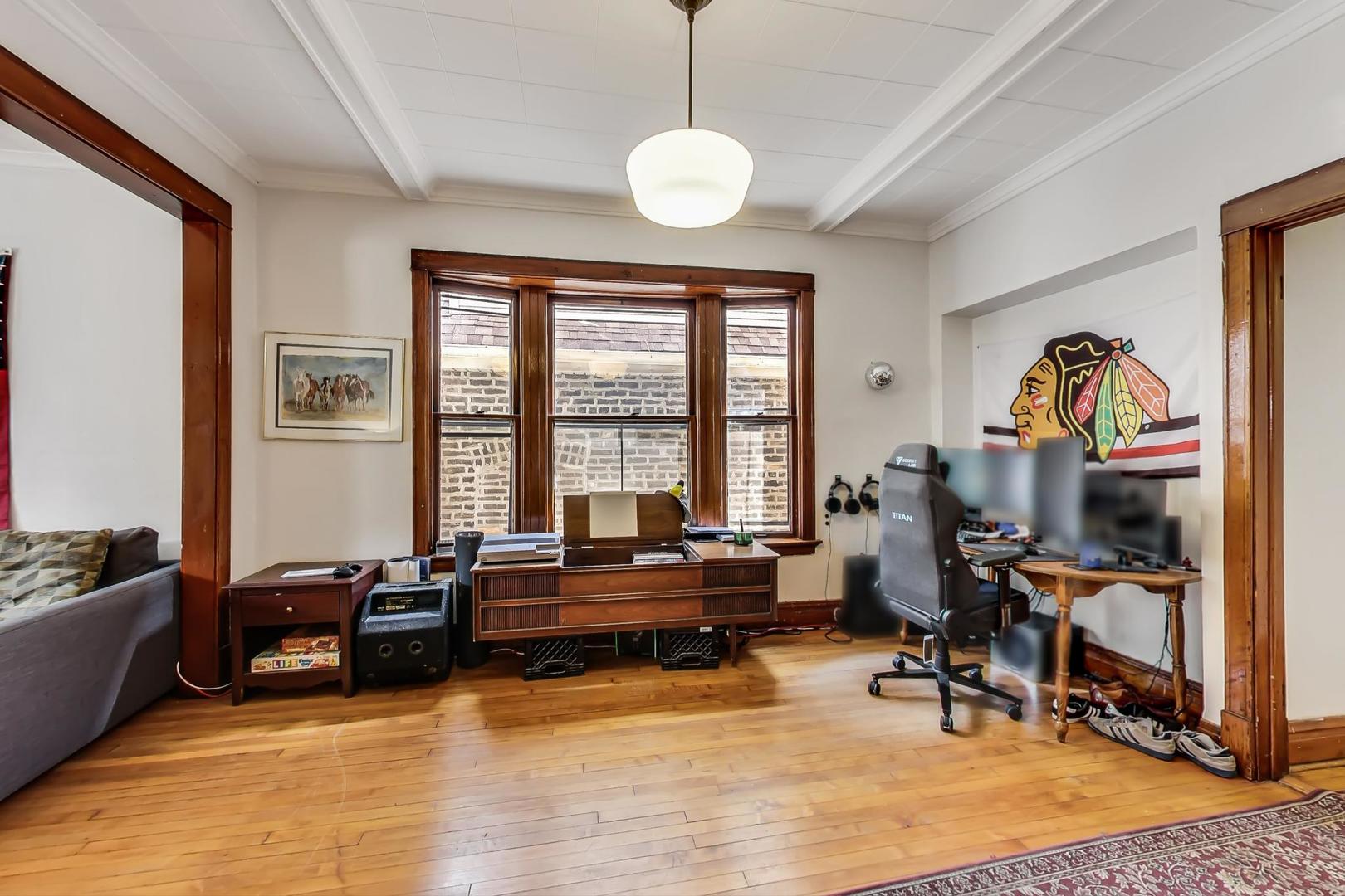 2145 West Thomas Street, Unit 2 Chicago, IL 60622 - Photo 6 of 14 a view of a livingroom with workspace and a window