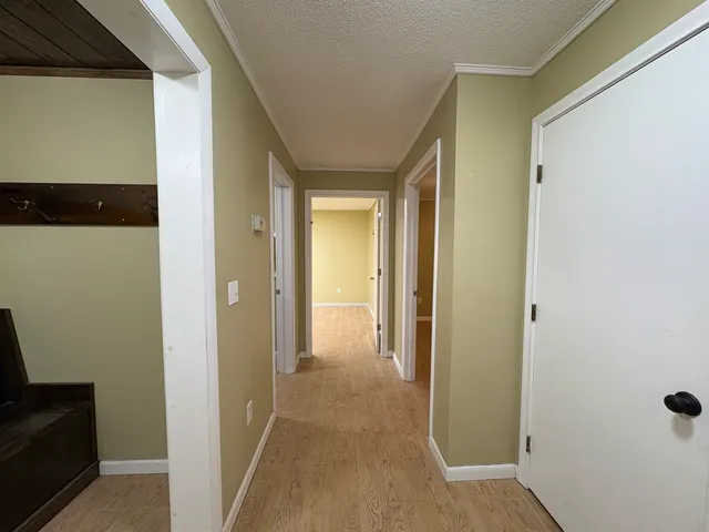 a view of a livingroom from a hallway