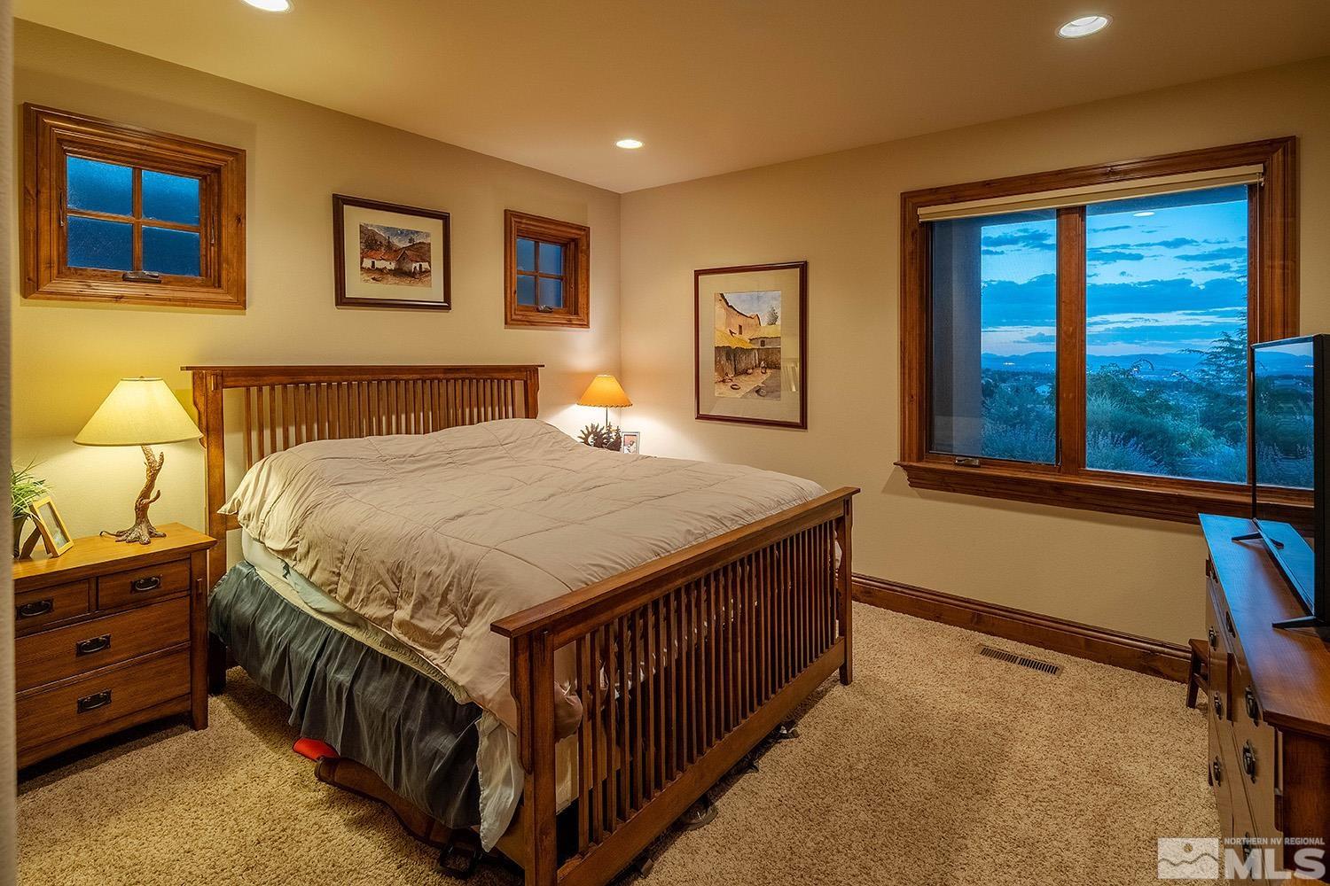 3745 Boulder Patch Reno, NV 89511 - Photo 22 of 40 a bed sitting in a bedroom next to a window