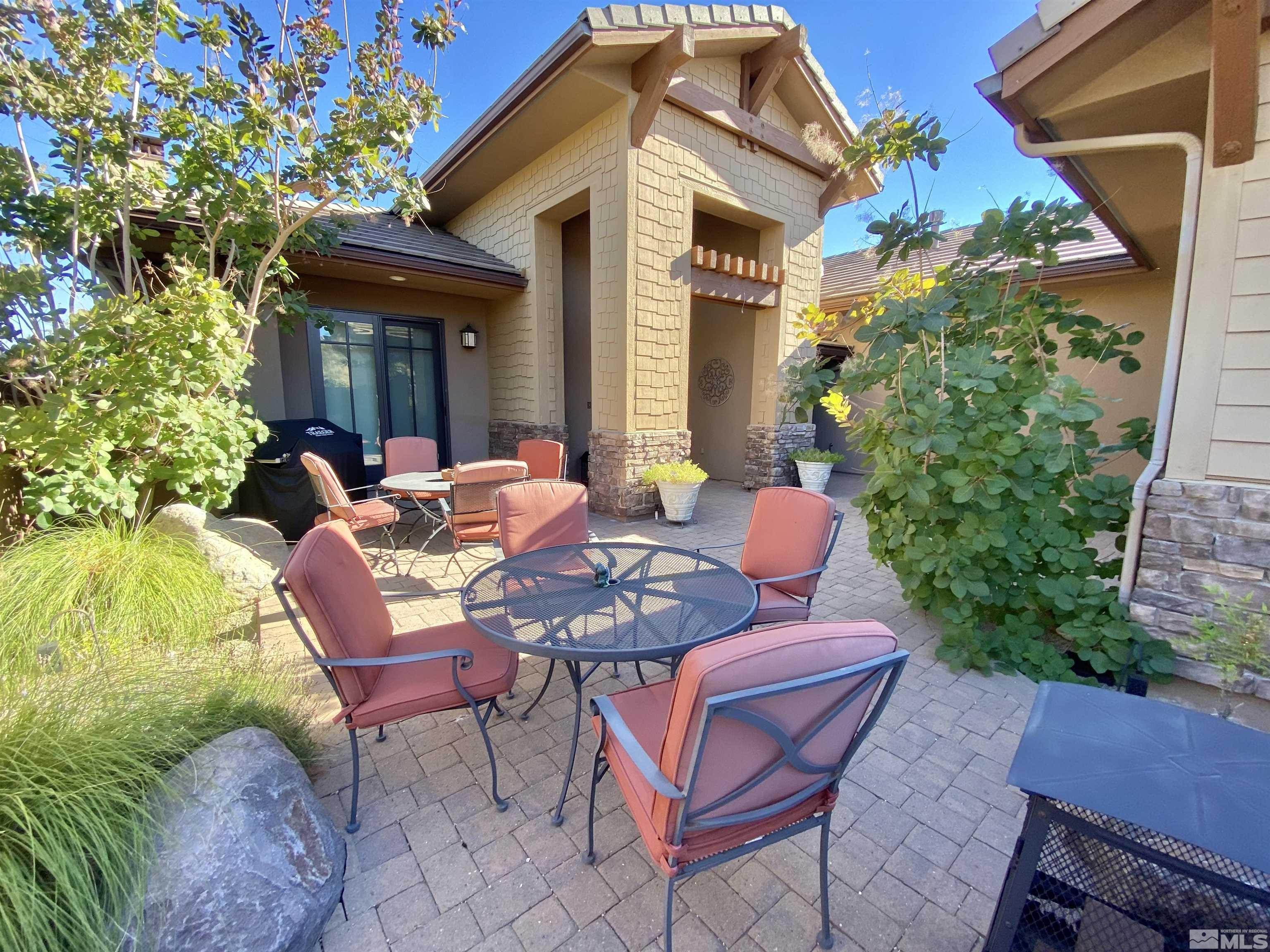 3745 Boulder Patch Reno, NV 89511 - Photo 4 of 40 a patio with a table and chairs and potted plants