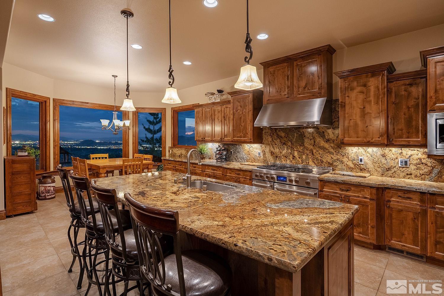 3745 Boulder Patch Reno, NV 89511 - Photo 8 of 40 a kitchen with a table and chairs in it