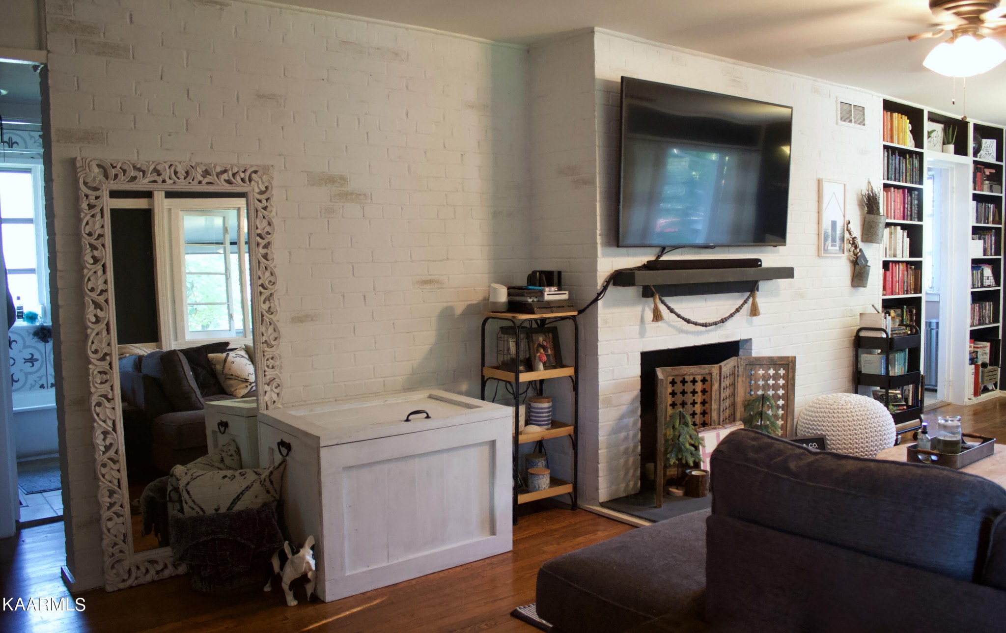 101 Norton Road Oak Ridge, TN 37830 - Photo 15 of 29 a living room with furniture a flat screen tv and a fireplace