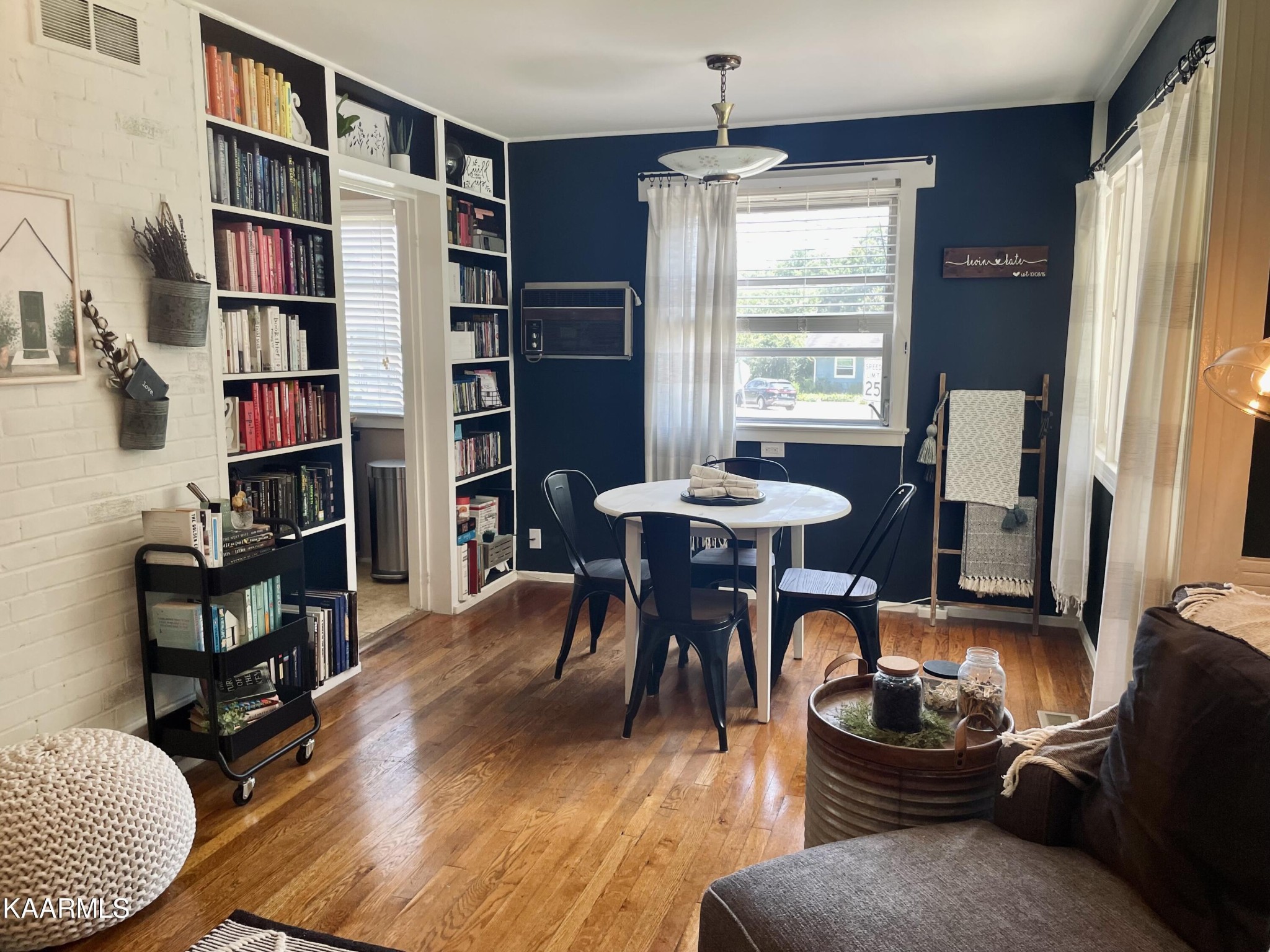 101 Norton Road Oak Ridge, TN 37830 - Photo 16 of 29 a living room with furniture a bookshelf and a window