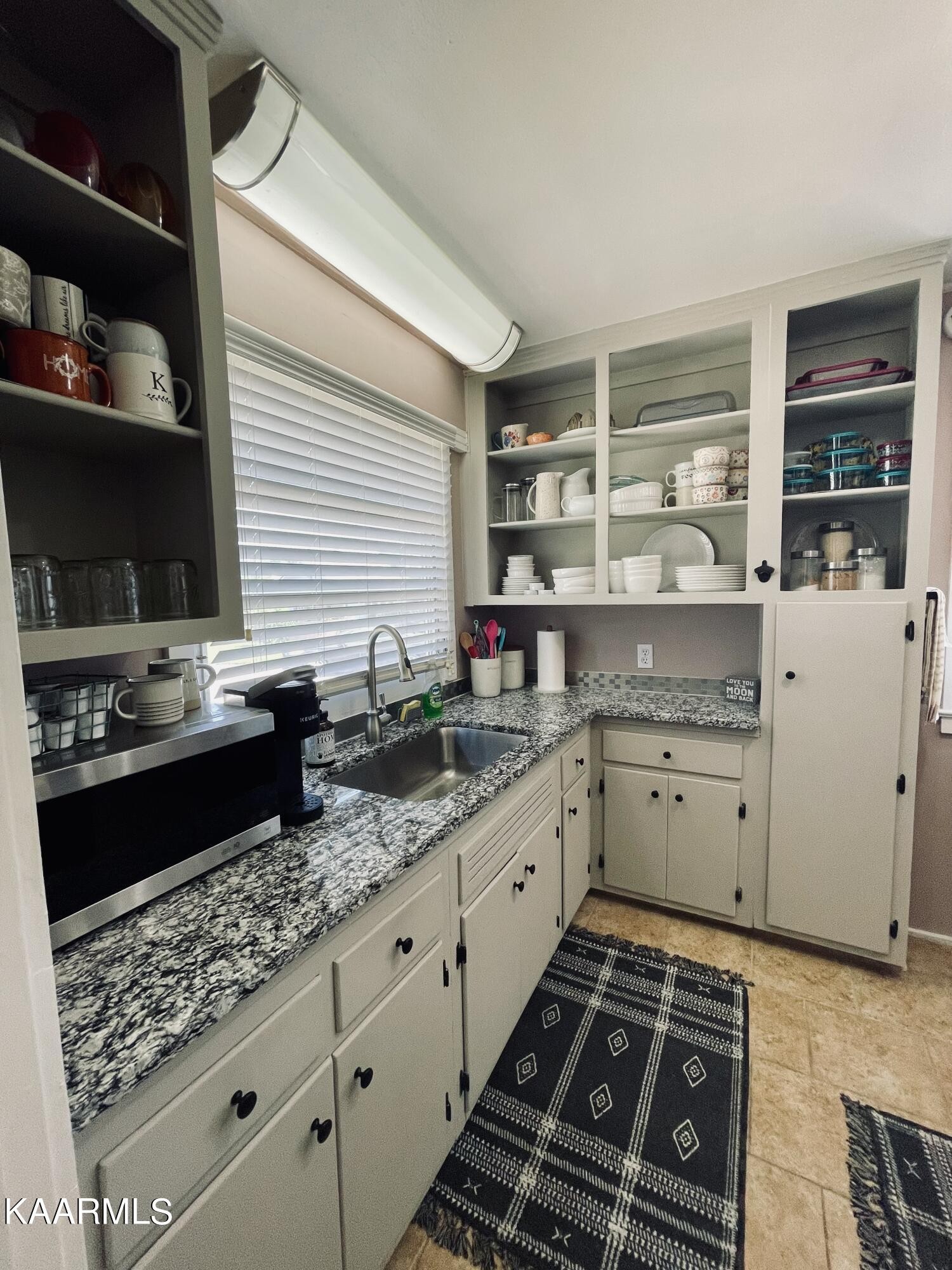 101 Norton Road Oak Ridge, TN 37830 - Photo 20 of 29 a kitchen with granite countertop a sink and cabinets