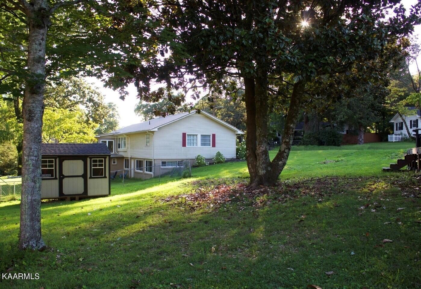 101 Norton Road Oak Ridge, TN 37830 - Photo 28 of 29 a backyard of a house with lots of green space