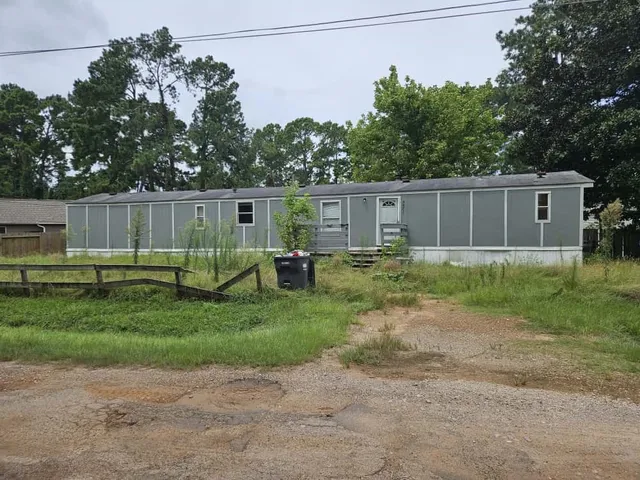 a backyard of a house with trampoline