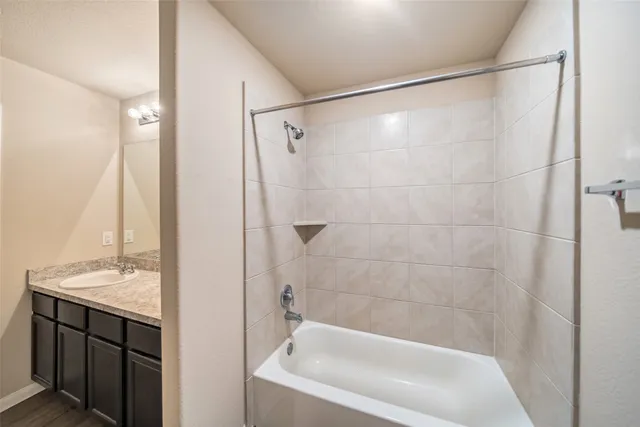 a bathroom with a shower and a sink