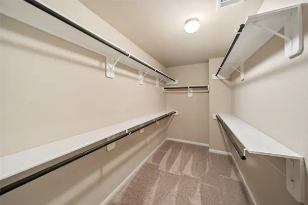 a view of a room with racks on the wall