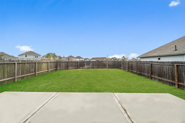 a view of a house with a yard and a large pool