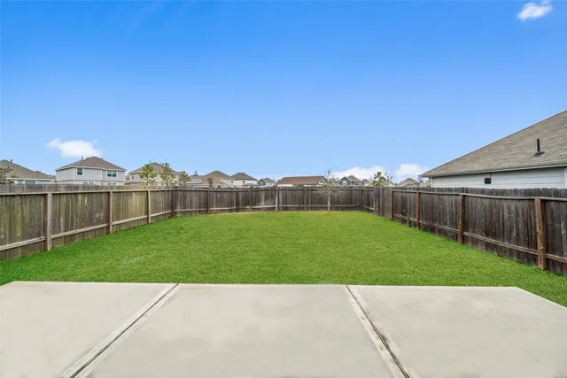 a view of a house with a yard and a large pool