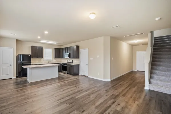 a view of kitchen with wooden floor