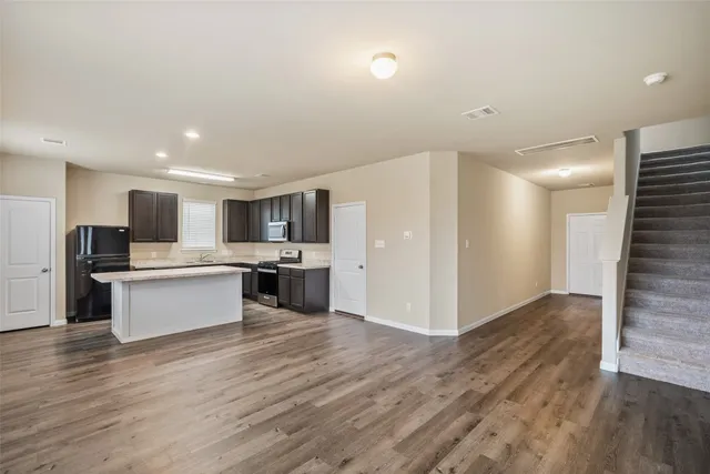 a view of kitchen with wooden floor