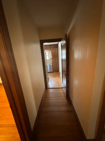 a bathroom with a sink a toilet a mirror and shower