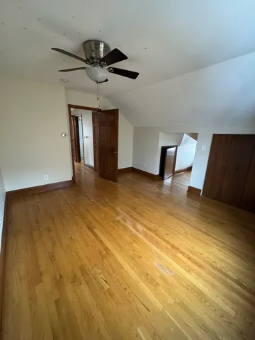 a view of a room with lot of furniture and windows