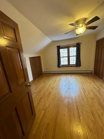 a view of storage and utility room with a fireplace
