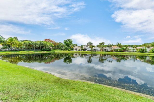 a view of a lake with houses in the back