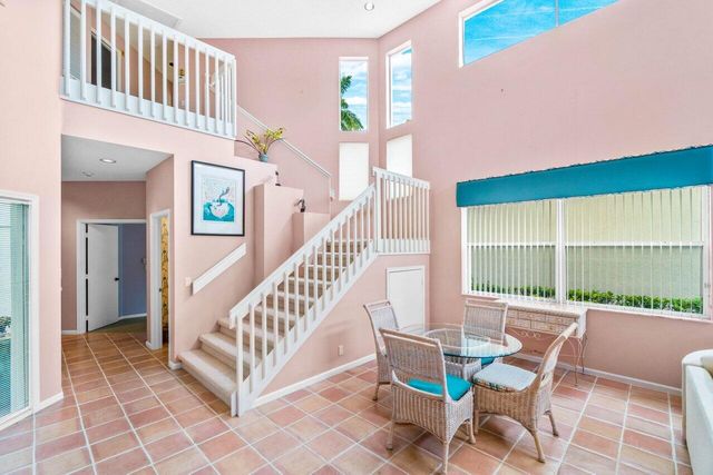 a view of a two chairs and table in the patio