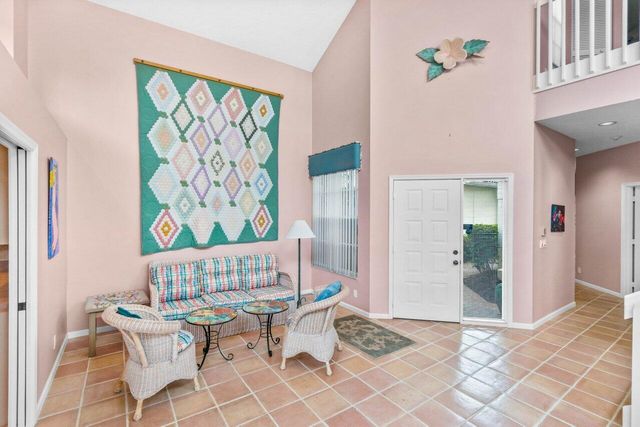 a view of a dining room with furniture wooden floor and a chandelier