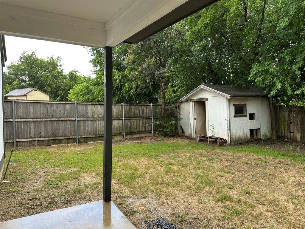 7629 Misty Ridge Drive North Fort Worth, TX 76137 - Photo 15 of 16 a view of a backyard with a garden and entertaining space