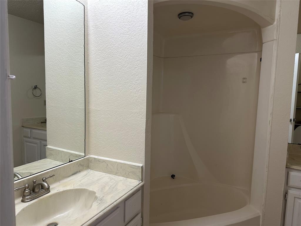 7629 Misty Ridge Drive North Fort Worth, TX 76137 - Photo 5 of 16 a bathroom with a sink and a mirror