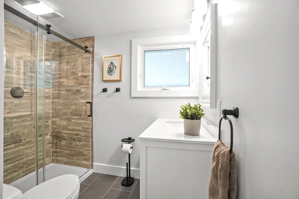 67 Montgomery Road Swansea, MA 02777 - Photo 11 of 41 a bathroom with a sink a toilet and shower