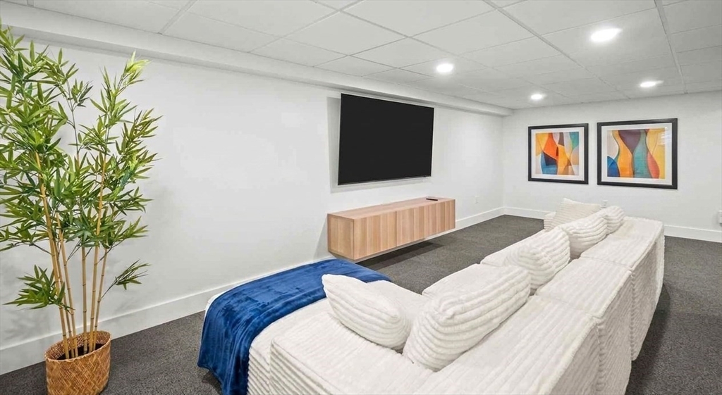 67 Montgomery Road Swansea, MA 02777 - Photo 19 of 41 a living room with furniture and a flat screen tv