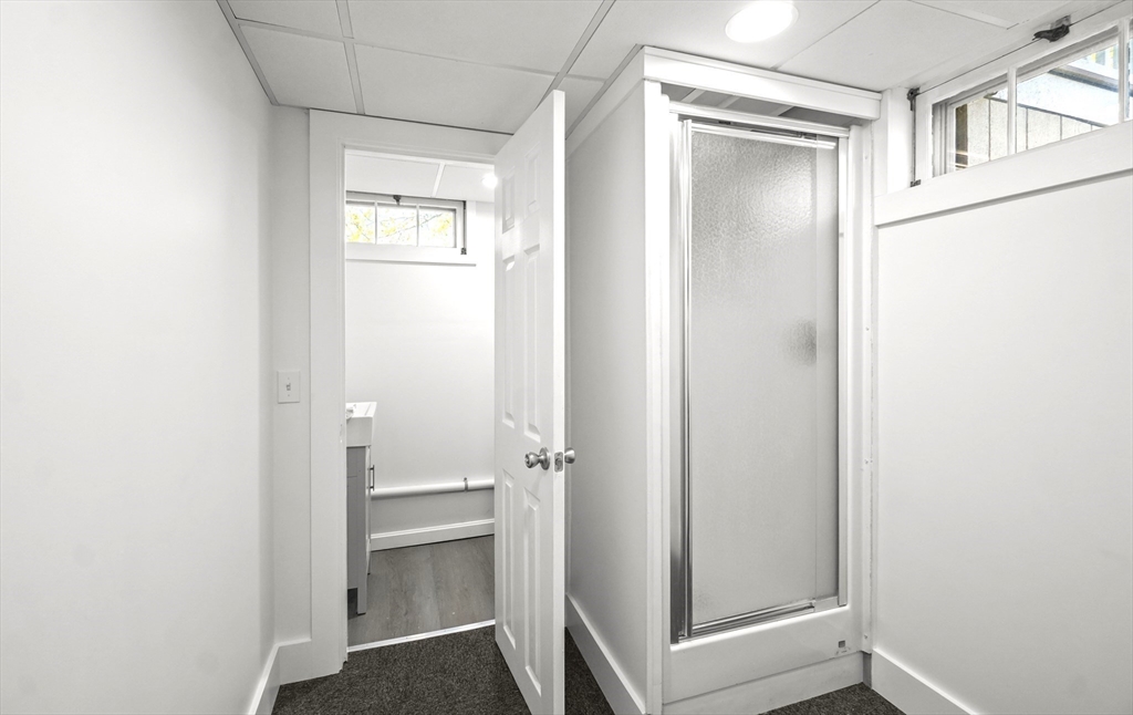 67 Montgomery Road Swansea, MA 02777 - Photo 20 of 41 a bathroom with a glass door shower and a sink