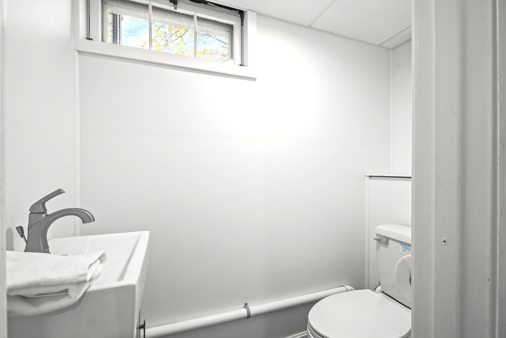 67 Montgomery Road Swansea, MA 02777 - Photo 21 of 41 a white toilet sitting next to a bathroom sink