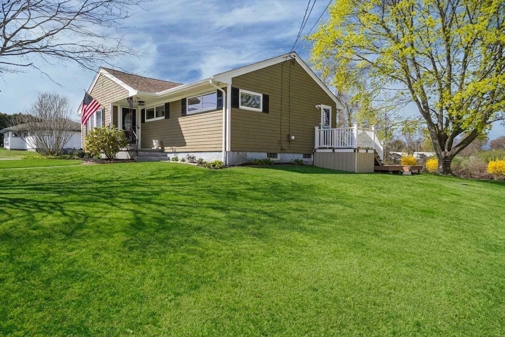 67 Montgomery Road Swansea, MA 02777 - Photo 26 of 41 a view of a house with a big yard and large trees