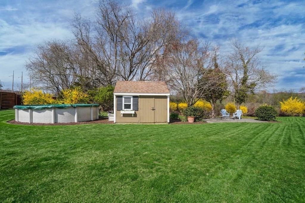67 Montgomery Road Swansea, MA 02777 - Photo 36 of 41 a view of a house with a big yard and large trees