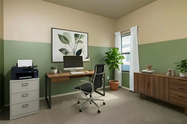 a workspace with furniture and window
