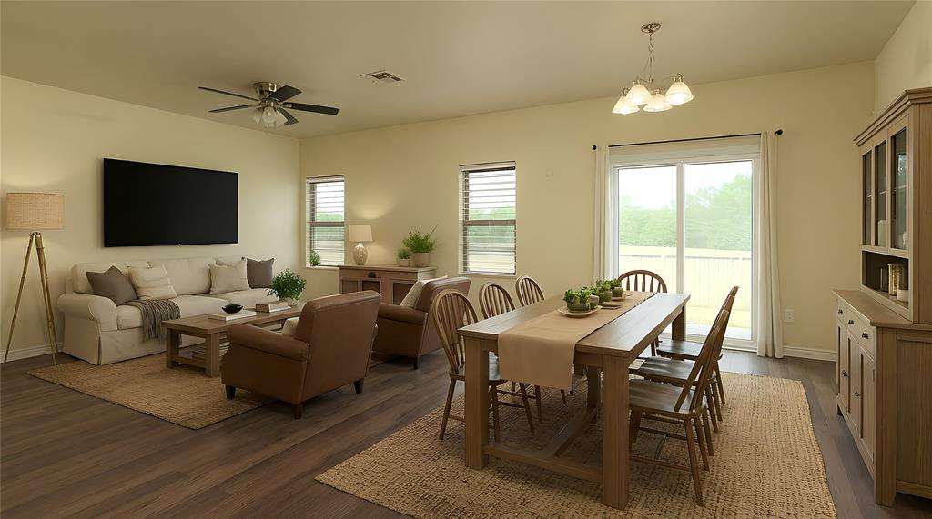 121 Mitchell Circle Terrell, TX 75160 - Photo 2 of 26 a living room with furniture a chandelier and a flat screen tv