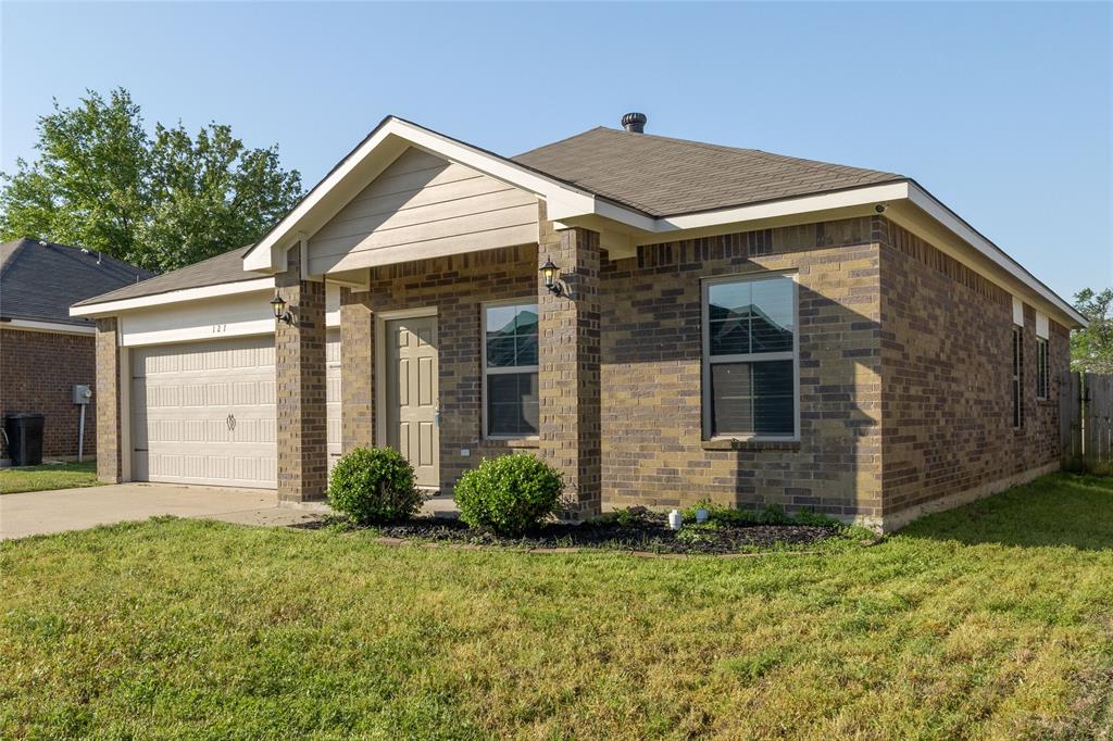 121 Mitchell Circle Terrell, TX 75160 - Photo 26 of 26 a front view of a house with garden
