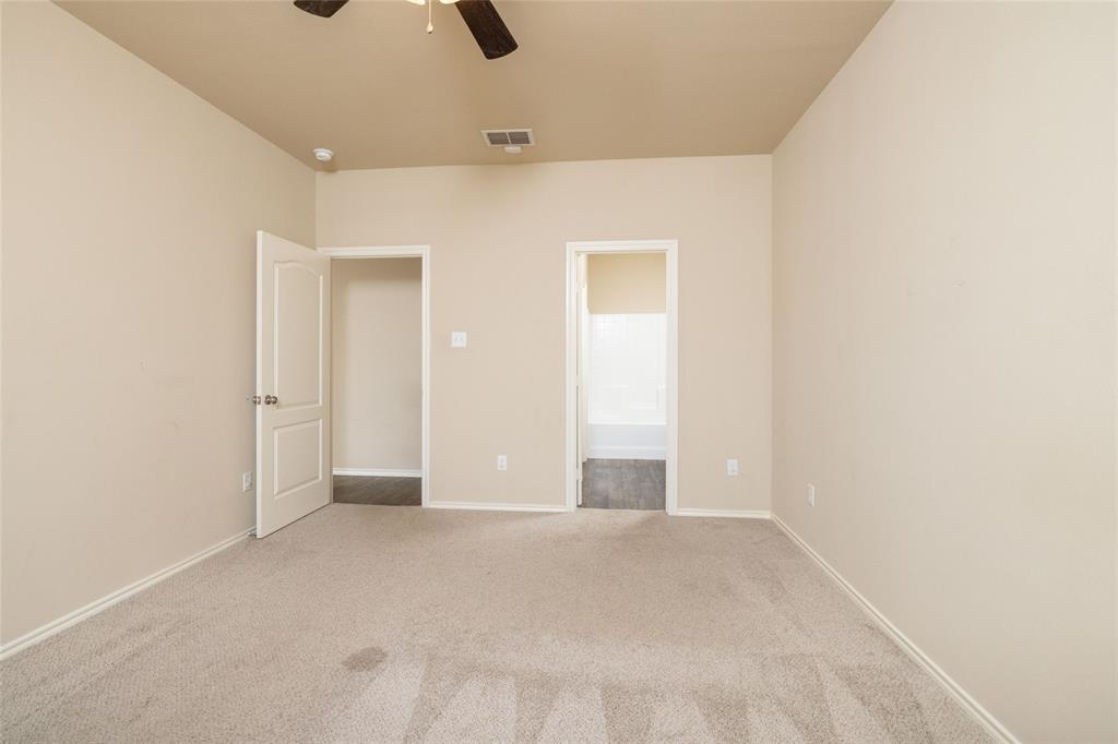 121 Mitchell Circle Terrell, TX 75160 - Photo 9 of 26 an empty room with fan