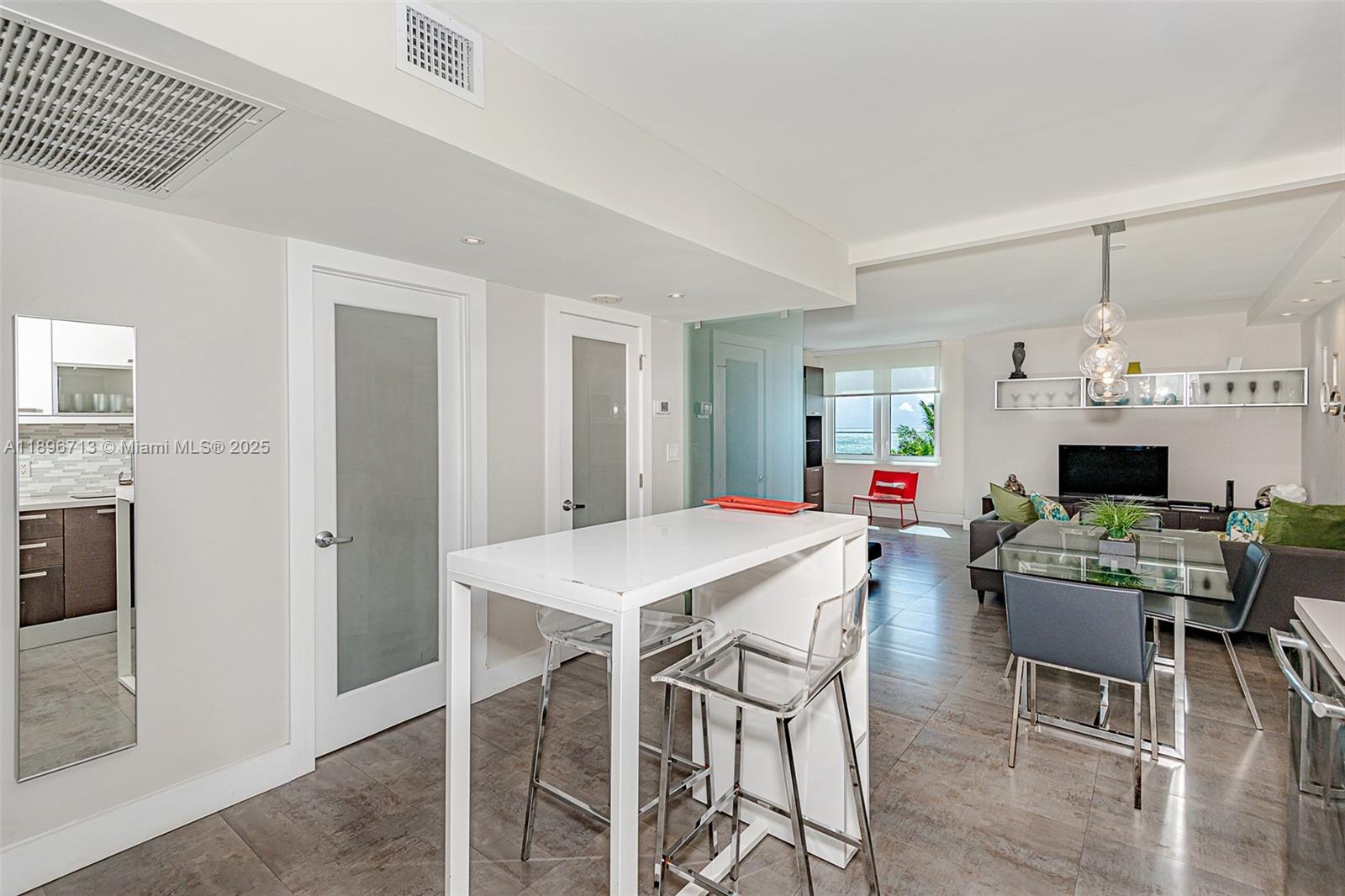 2301 Collins Avenue, Unit 723 Miami Beach, FL 33139 - Photo 2 of 26 a view of a dining room with furniture