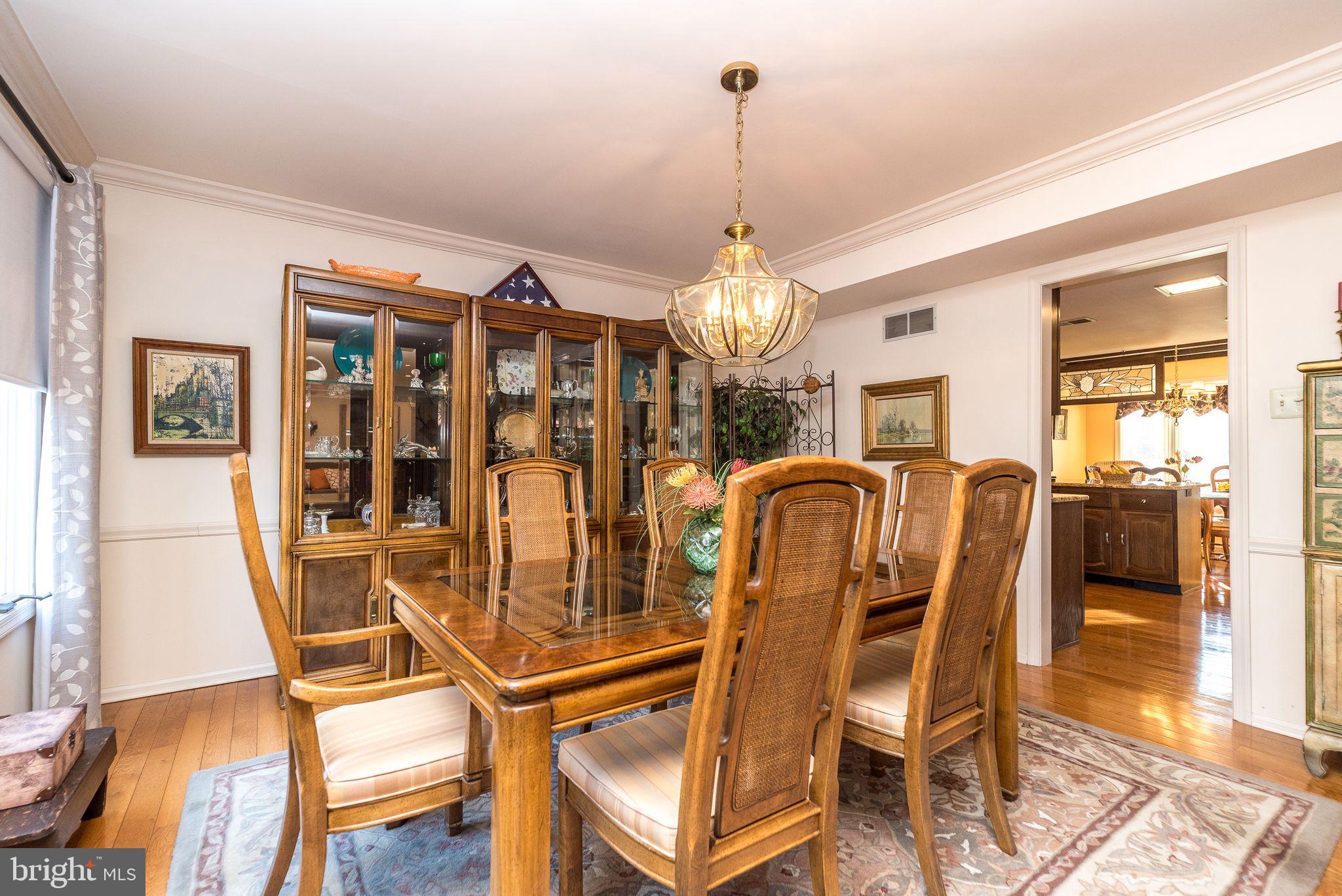68 Amity Drive Chesterbrook, PA 19087 - Photo 14 of 62 a view of a dining room with furniture and chandelier