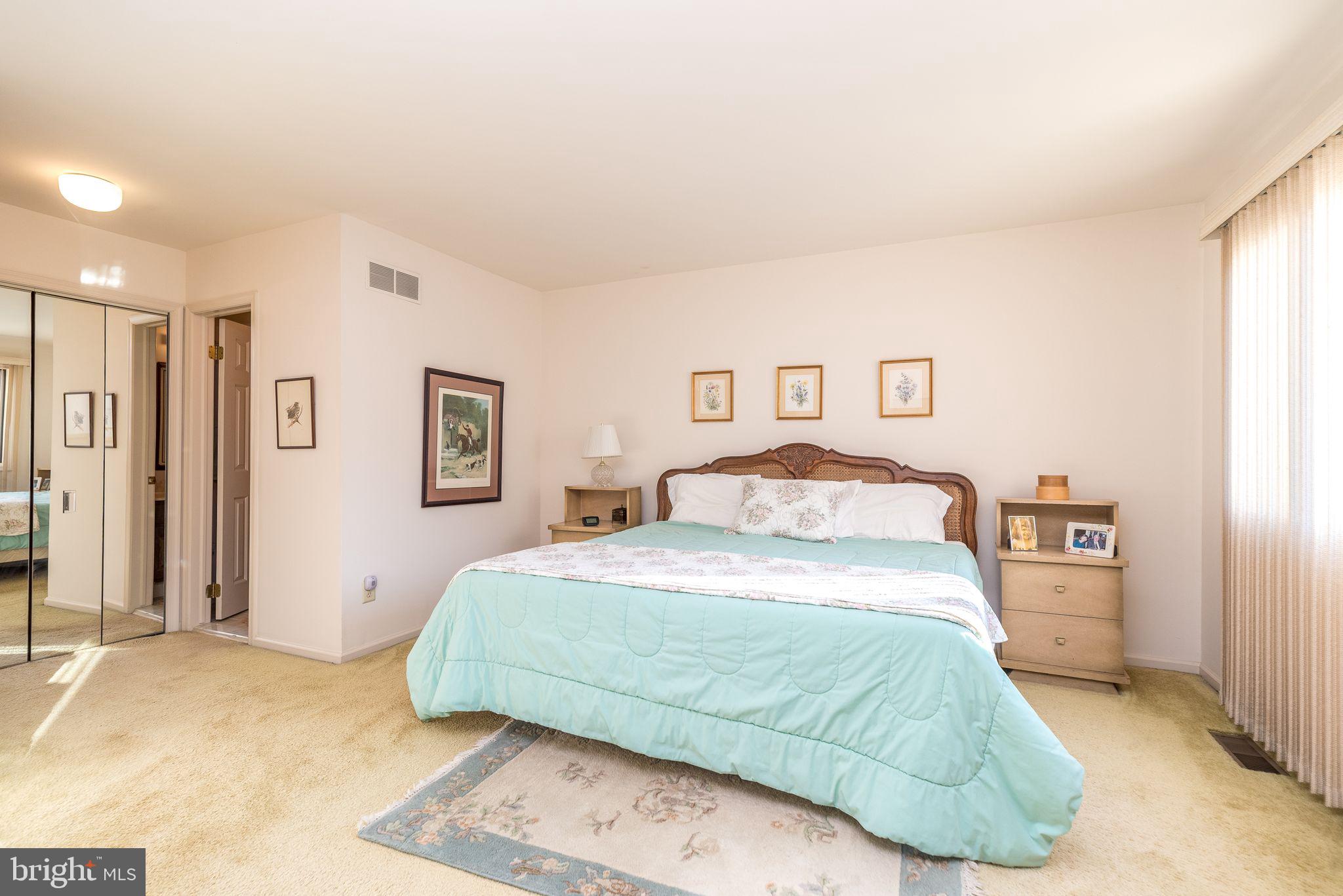 68 Amity Drive Chesterbrook, PA 19087 - Photo 32 of 62 a bedroom with a bed and painting on the wall